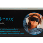 Sound Oasis Just Darkness Sleep Therapy Mask packaging box, black with blue and white text and a circular photo of a woman wearing the sleep mask.