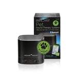 Sound Oasis Pet Sound Therapy System speaker in black with a green 'Vet Approved' paw print sticker, shown in front of its retail packaging box on a white background.
